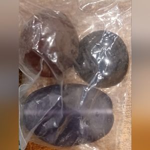 Bag of dark large oblong polished organic beads/rocks